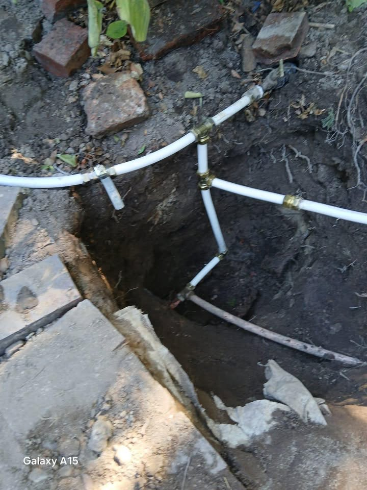 White pipes and brass fittings installed on a wall